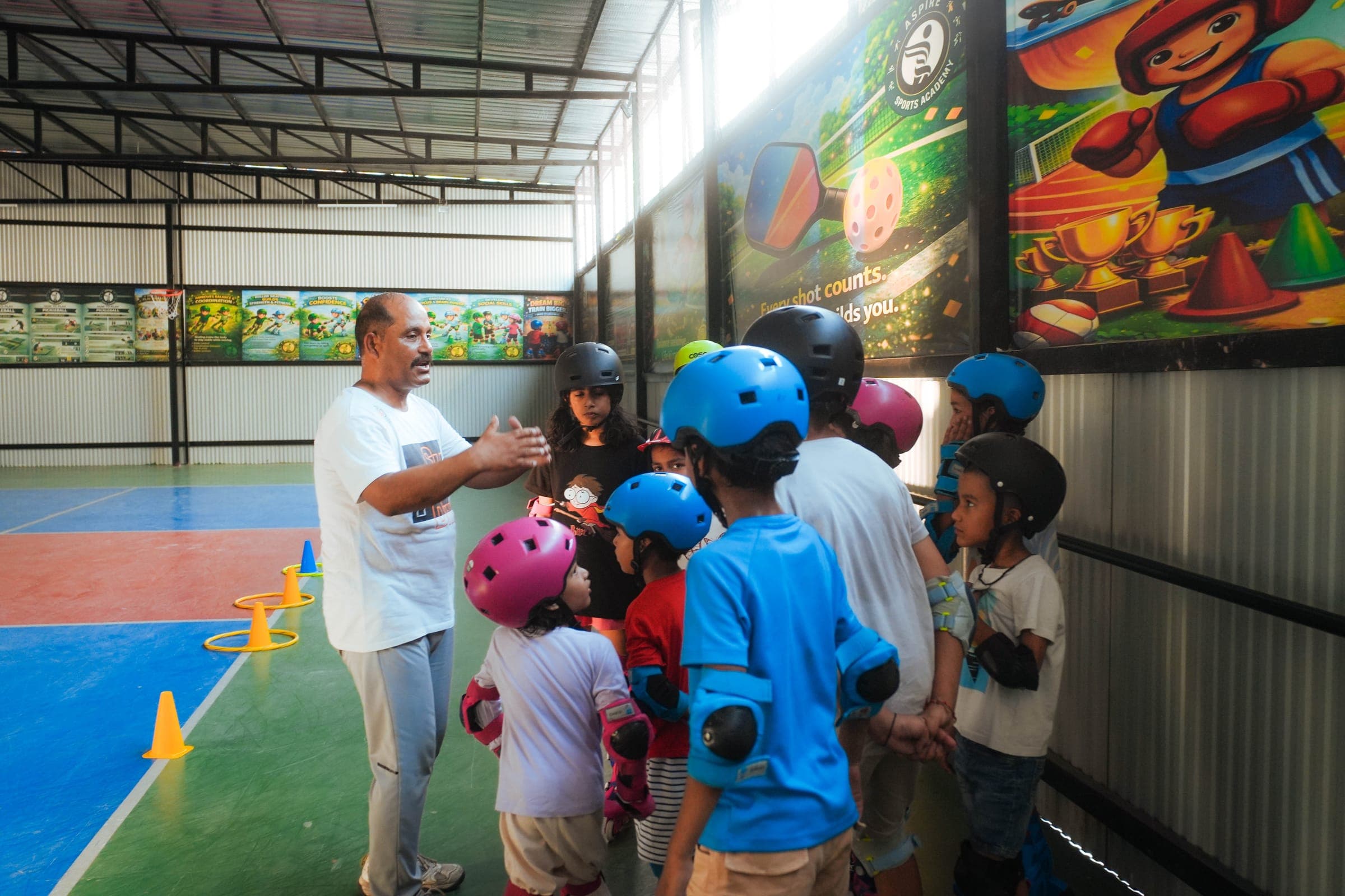 Skating coach instructing students at Aspire Sports Academy