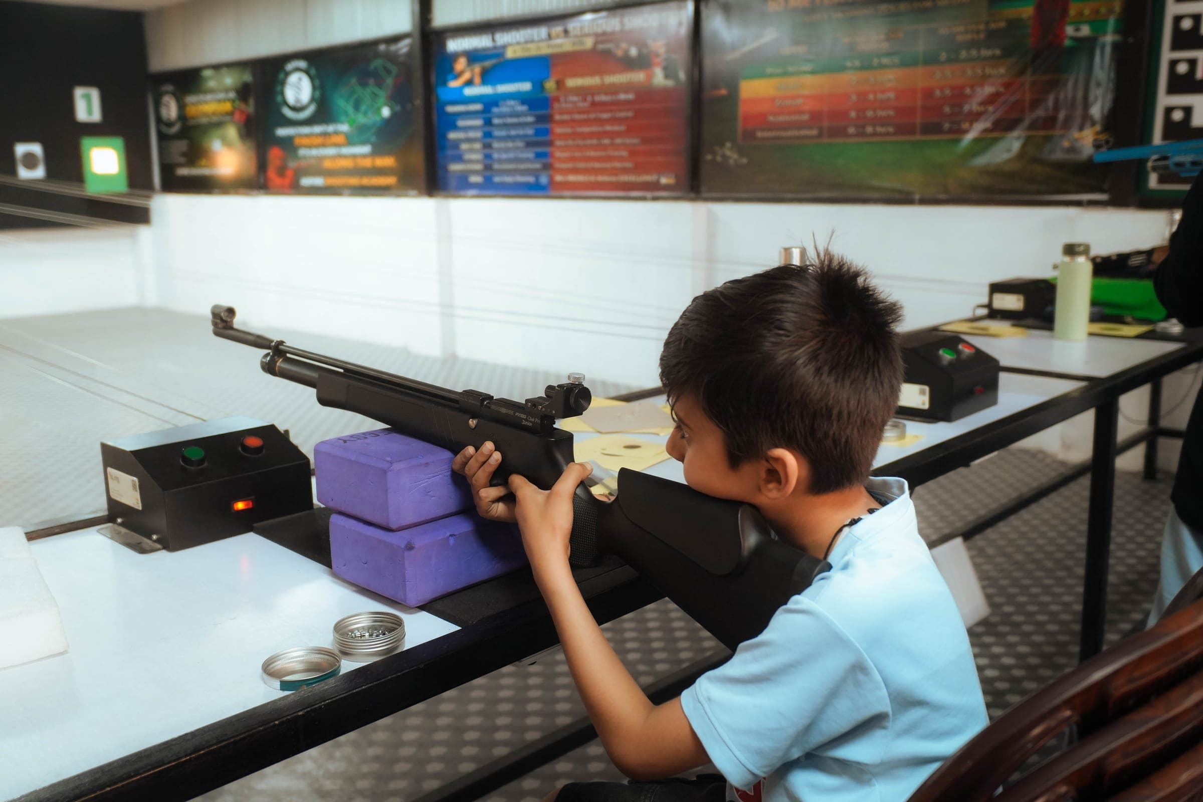 Youth shooting practice at Aspire Sports Academy
